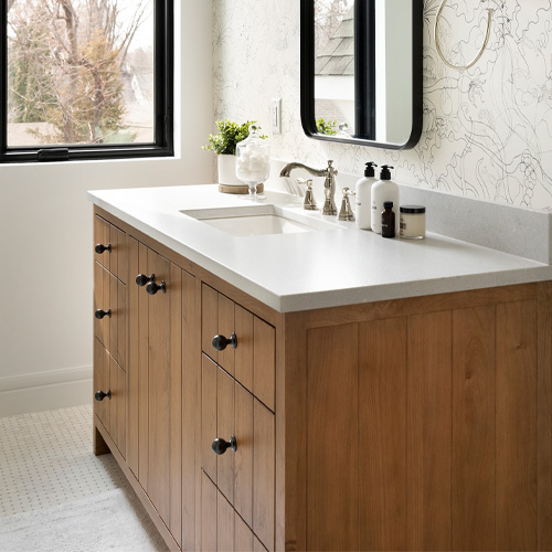 Murphy Vanity is a stained alder with lacquered brass hardware knobs