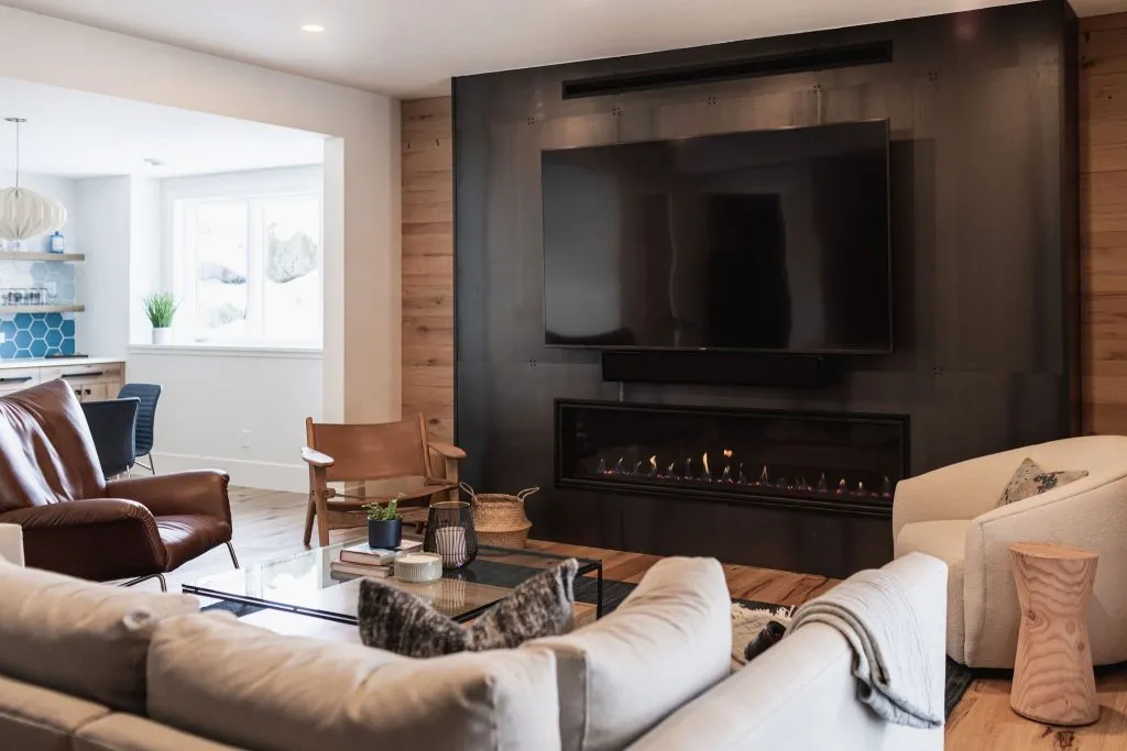Metal fireplace surround with reclaimed white oak surround