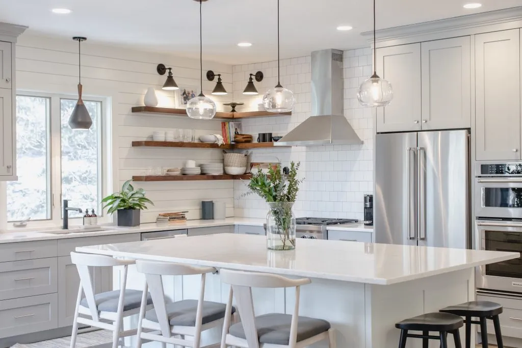 Modern grey and white kitchen with walnut floating shelves