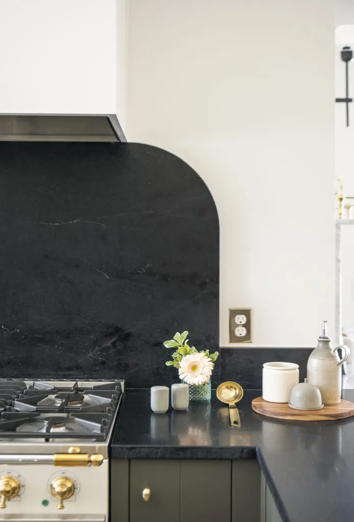 Soapstone radius backsplash.