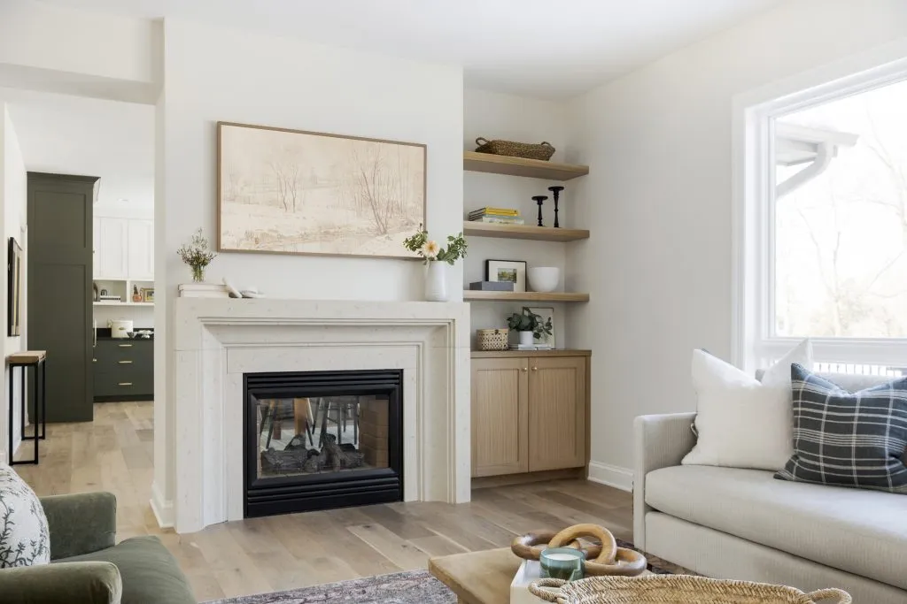 Cast stone fireplace surround, white oak cabinetry and open shelves.