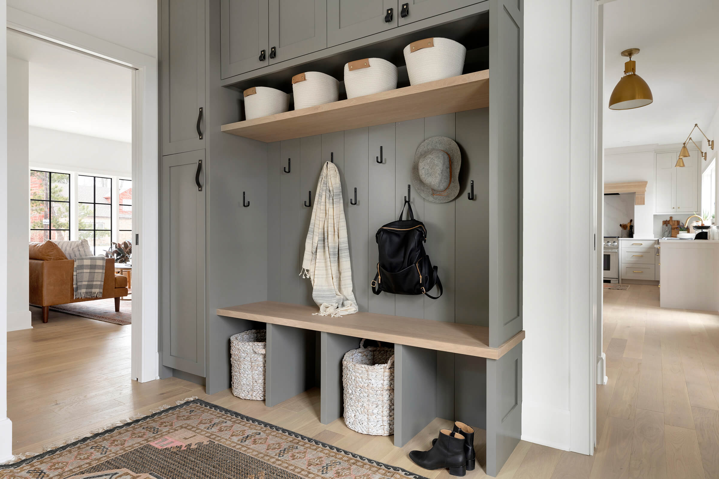 Adding a mudroom and powder room into a main floor plan are amongst our most requested items on a renovation wish list. For everyday use these spaces are a game changer.