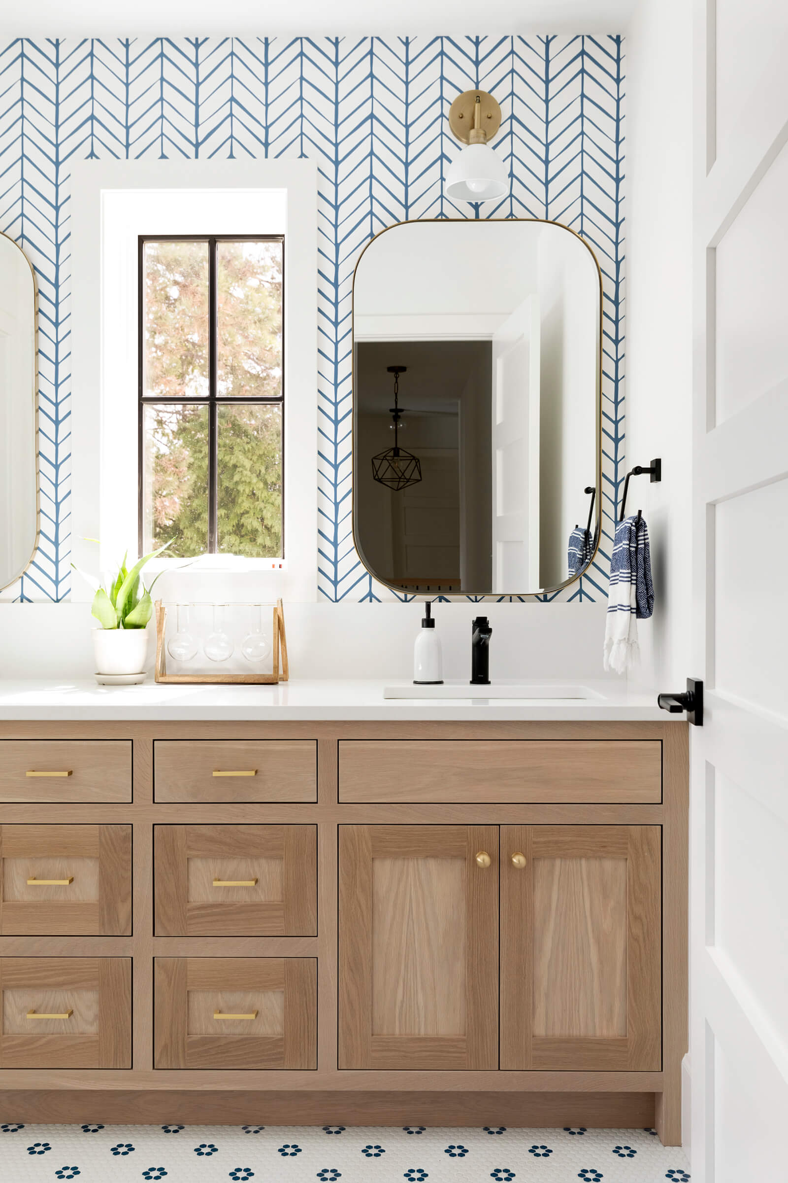 Guess bath with statement wallpaper, paired with natural white oak bathroom vanity.