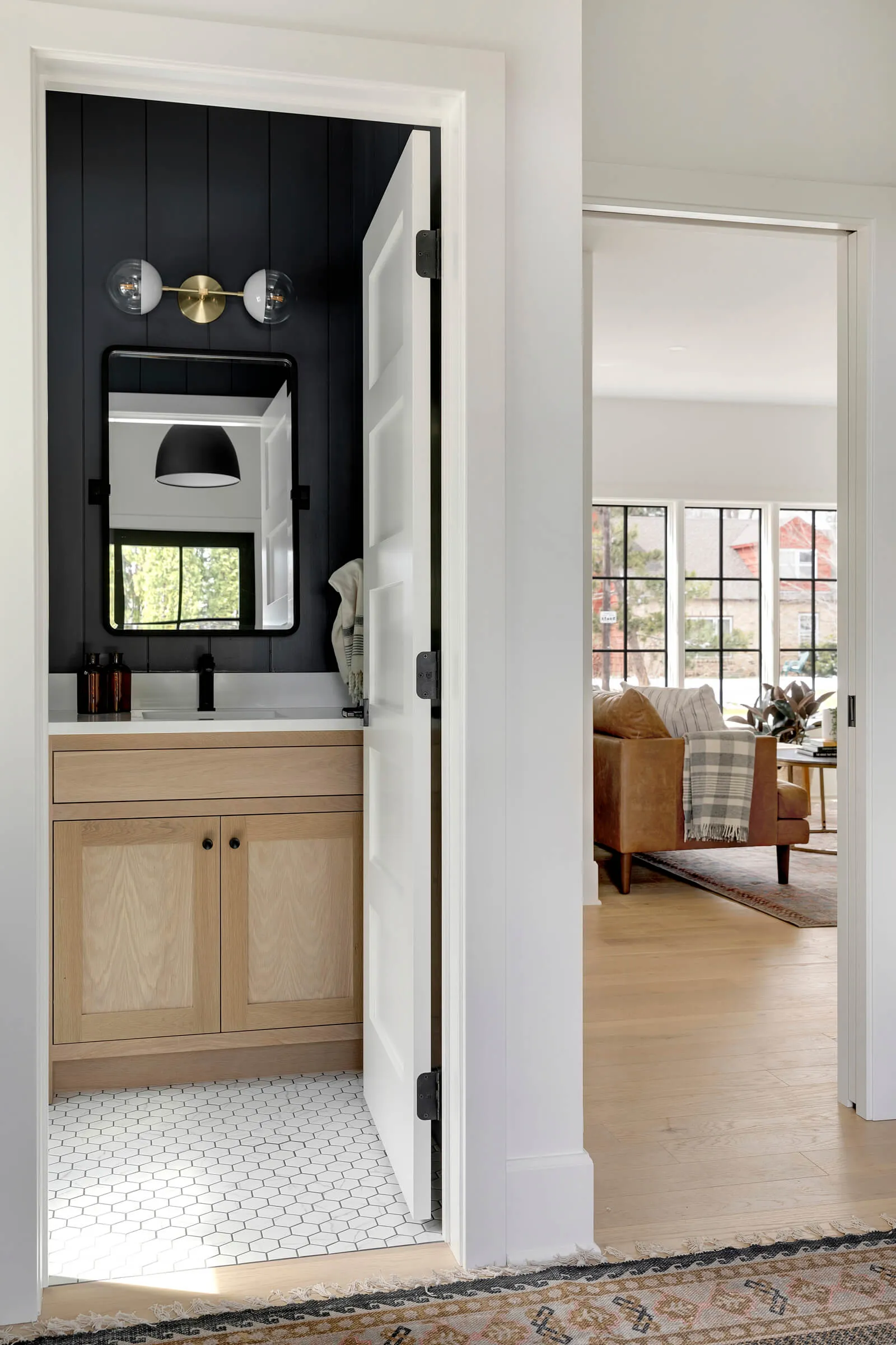 Adding a mudroom and powder room into a main floor plan are amongst our most requested items on a renovation wish list. For everyday use these spaces are a game changer.