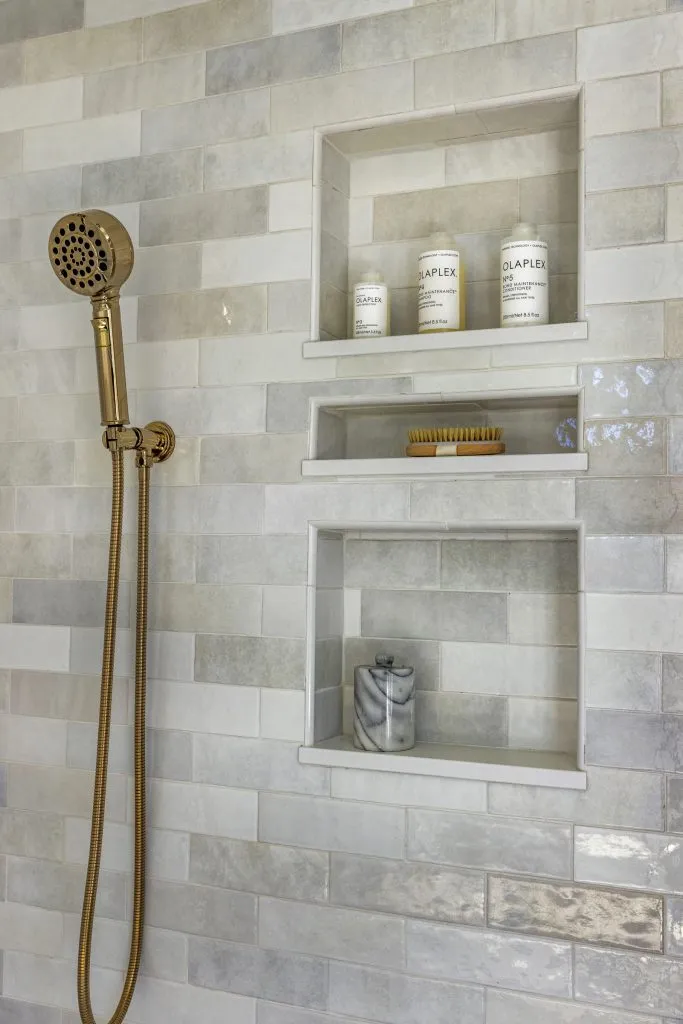 Custom shower niche details for maximum storage solutions.