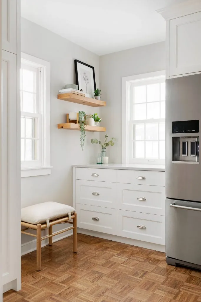Balboa Mist painted kitchen walls, bright white custom cabinetry