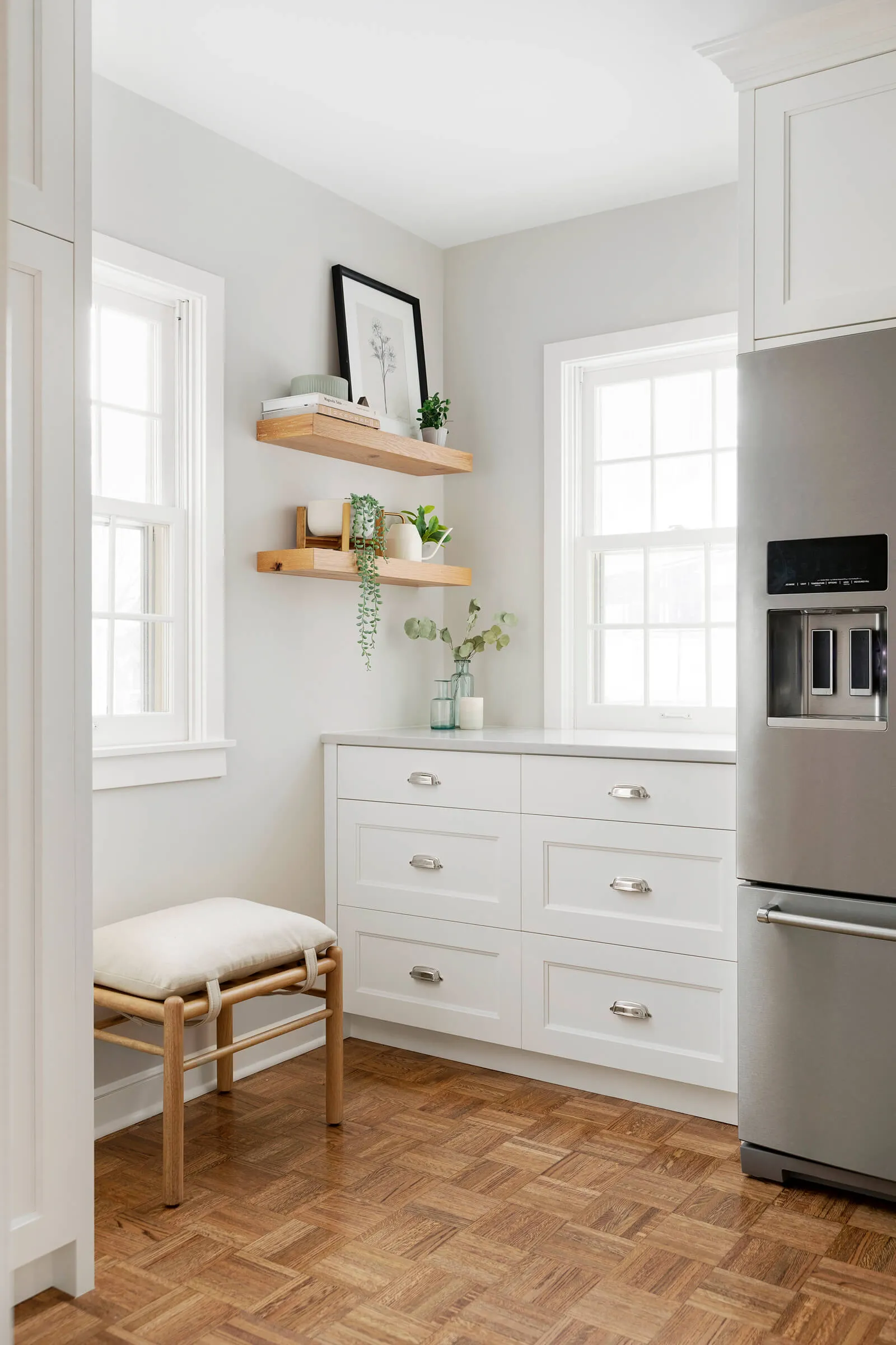 Balboa Mist painted kitchen walls, bright white custom cabinetry