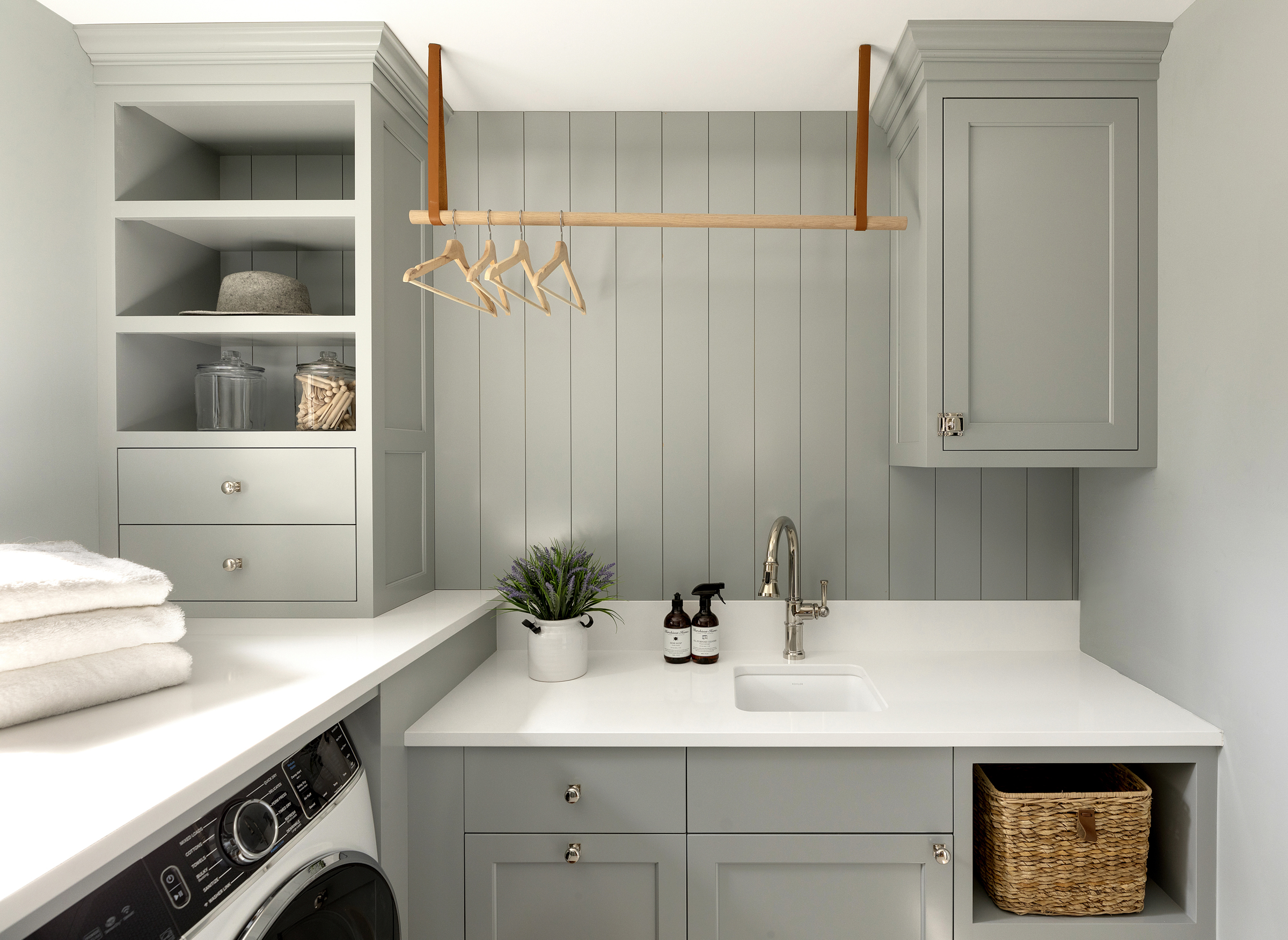 Laundry room, gray blue painted cabinetry and walls.