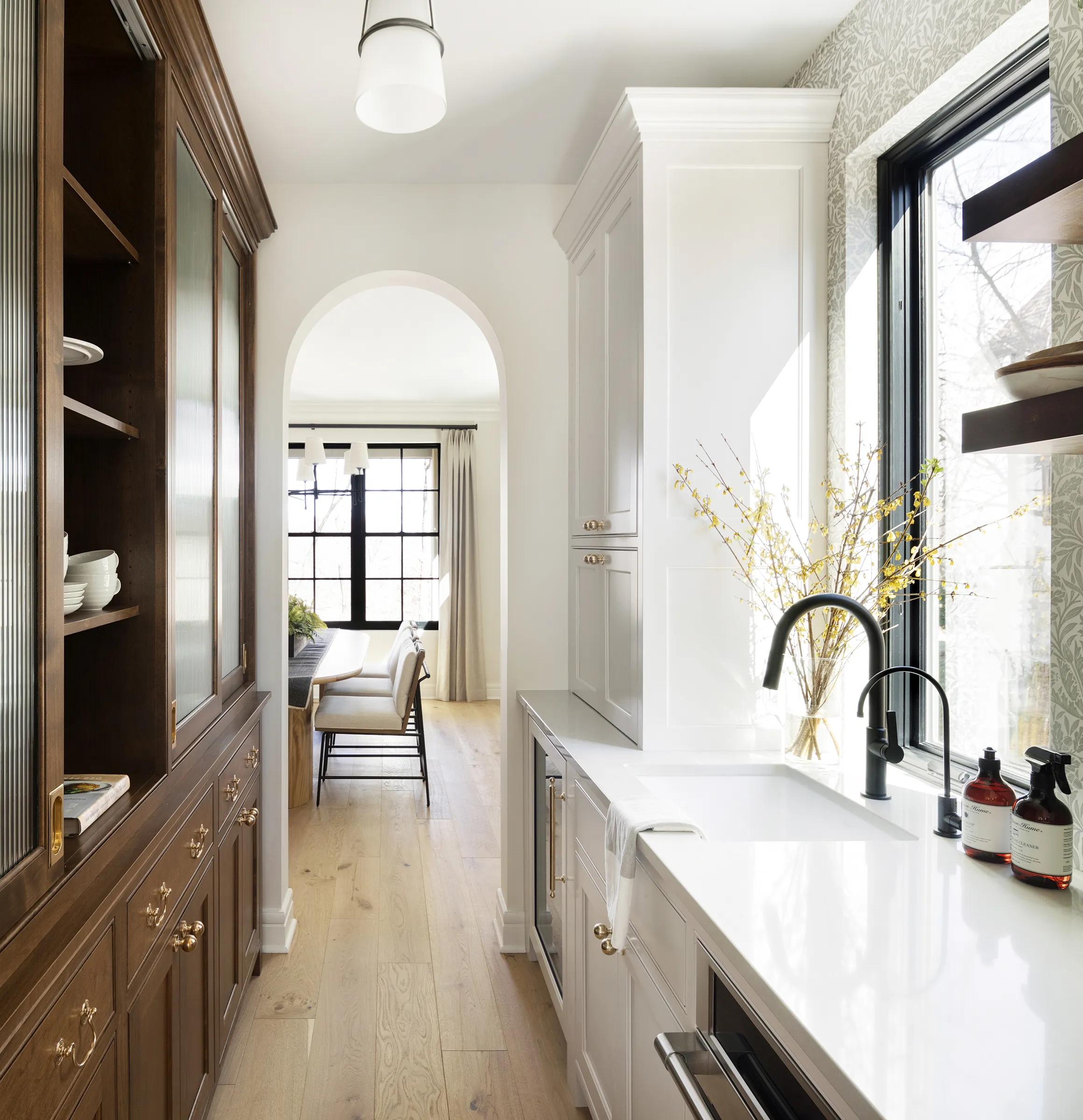 Alder wood pantry with reeded glass doors.