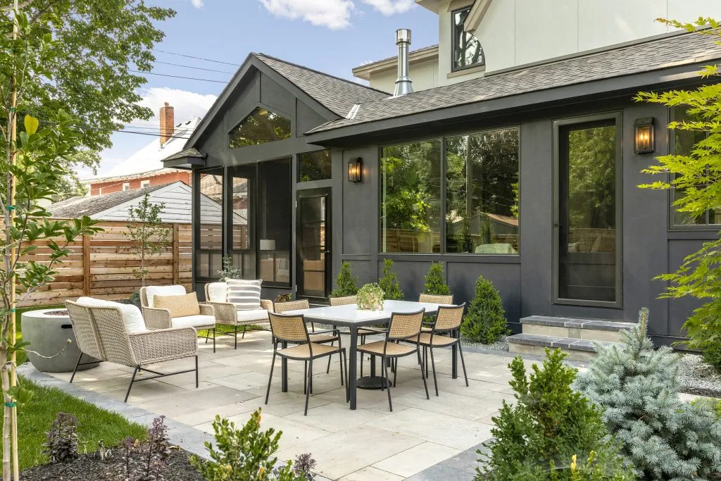 Screen porch with vinyl windows featuring Benjamin Moore Wrought Iron paint.