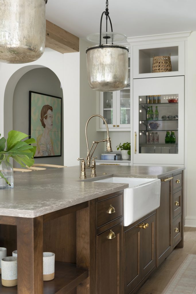 Alder wood kitchen island, integrated refrigerator with apron sink.