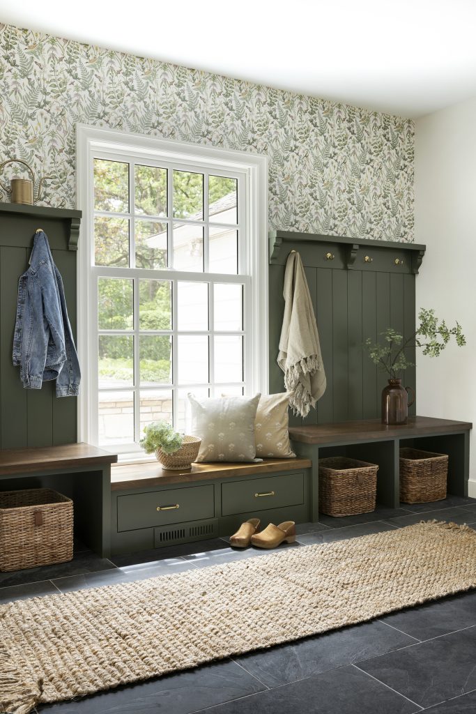 Forestwood Green painted mudroom cabinetry, vintage floral wallpaper.