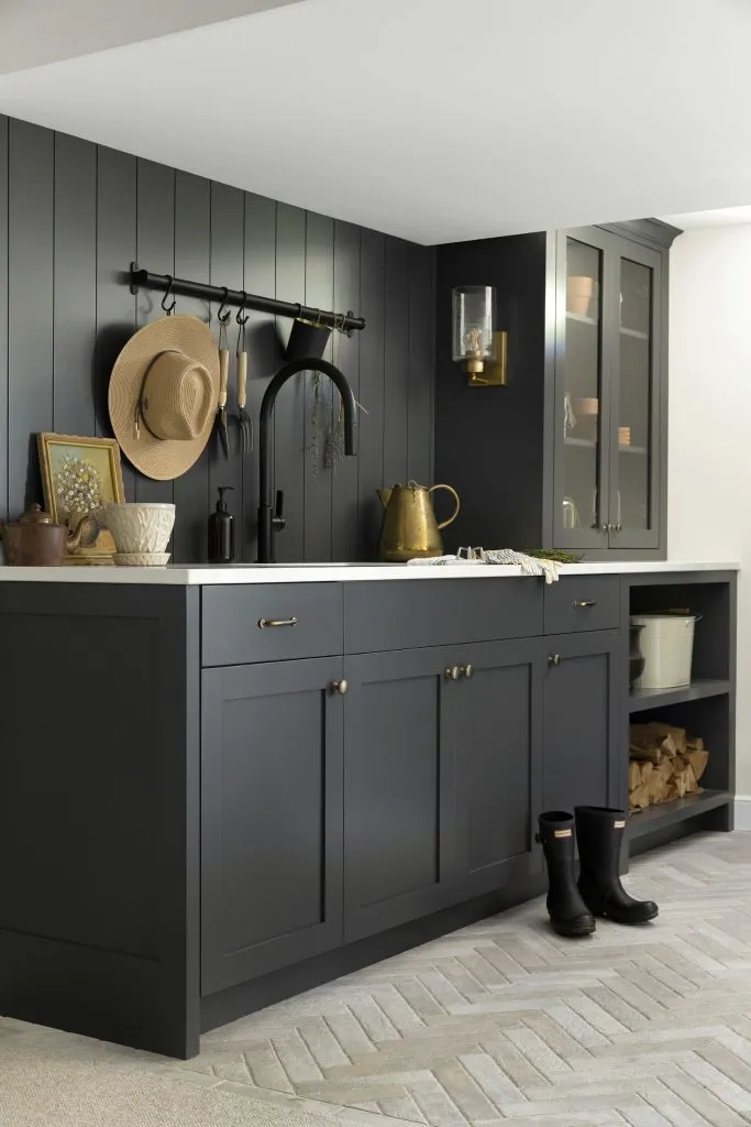 Garden center cabinetry, hand washing station and herringbone laid floor tile.