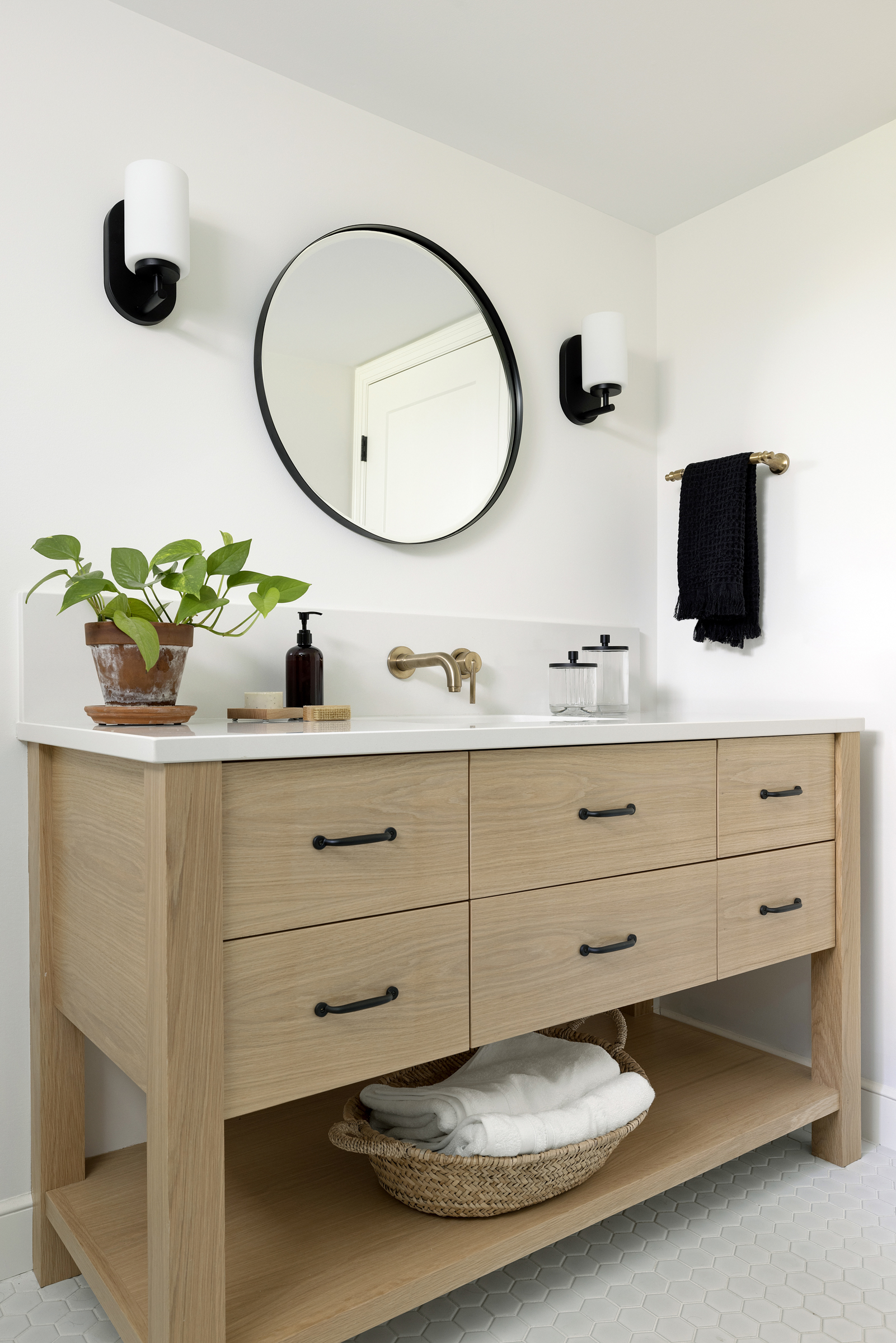 White oak custom Arden vanity with lower shelf, wall mount faucet