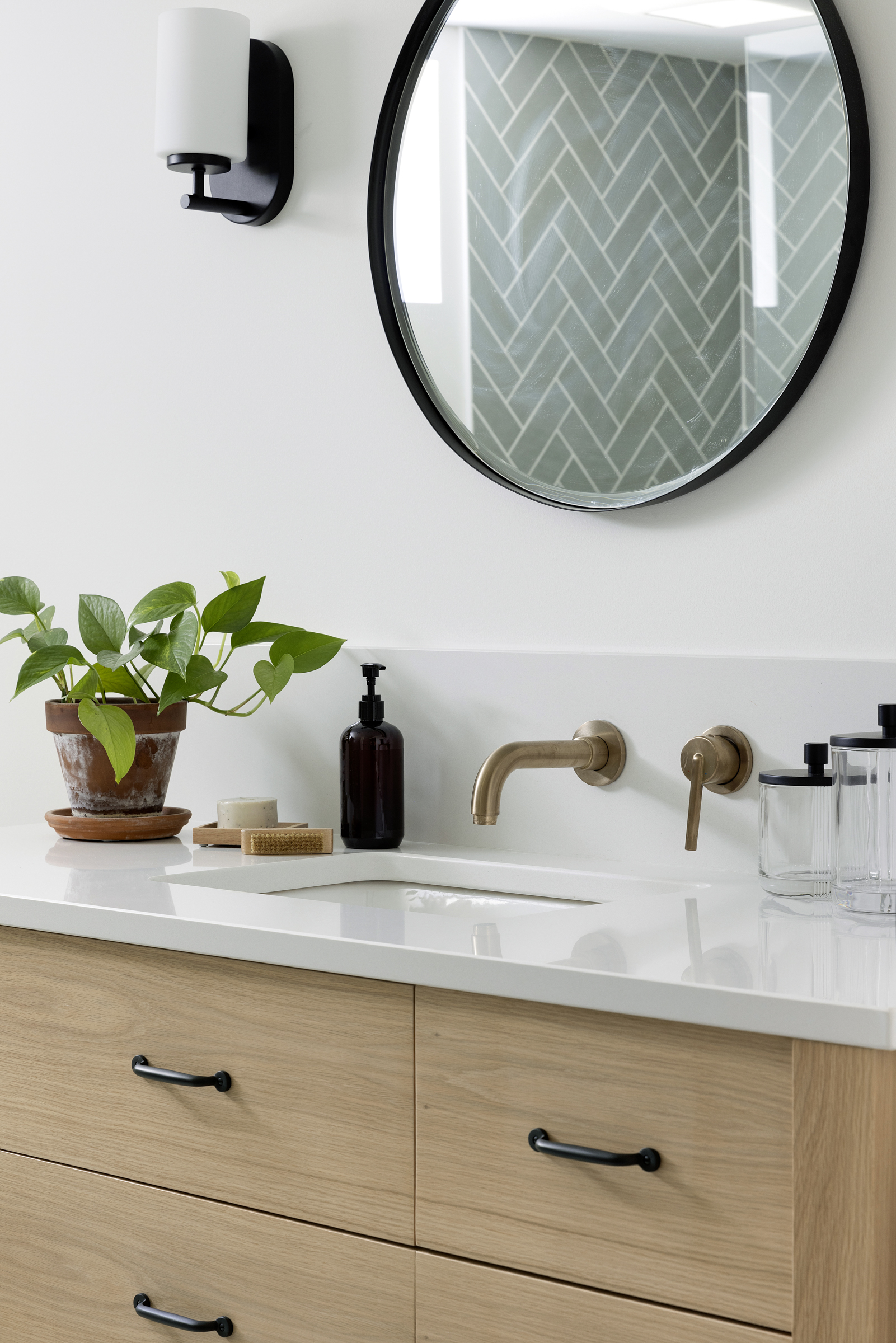 Twin Cities bathroom renovation with white oak Jkath Arden vanity and wall mounted faucet.