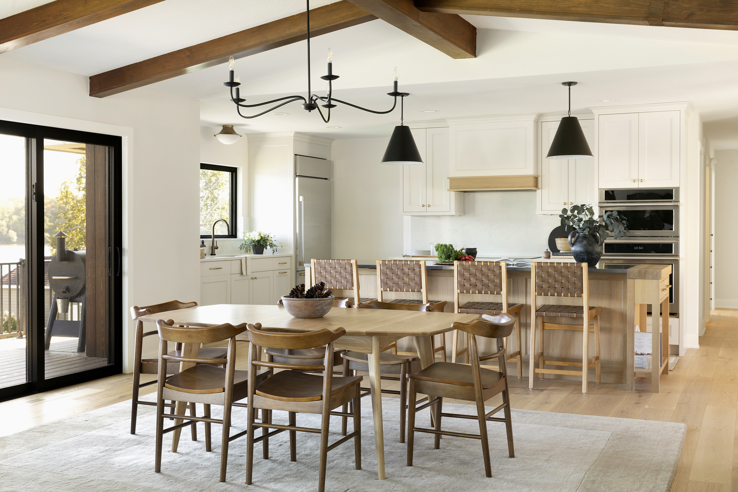 Open floorpan, neutral tone kitchen. Modern minimalism with clean lines.
