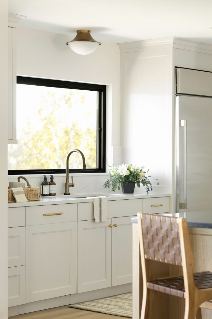 Sherwin Williams Limewash painted custom kitchen cabinetry.