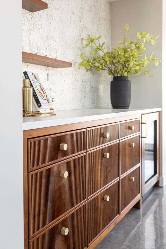Detailed reeded custom cabinetry.
