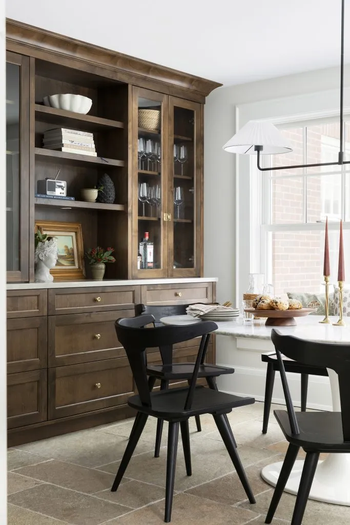 French inspired dining table with heirloom hutch and original cabinet hardware.