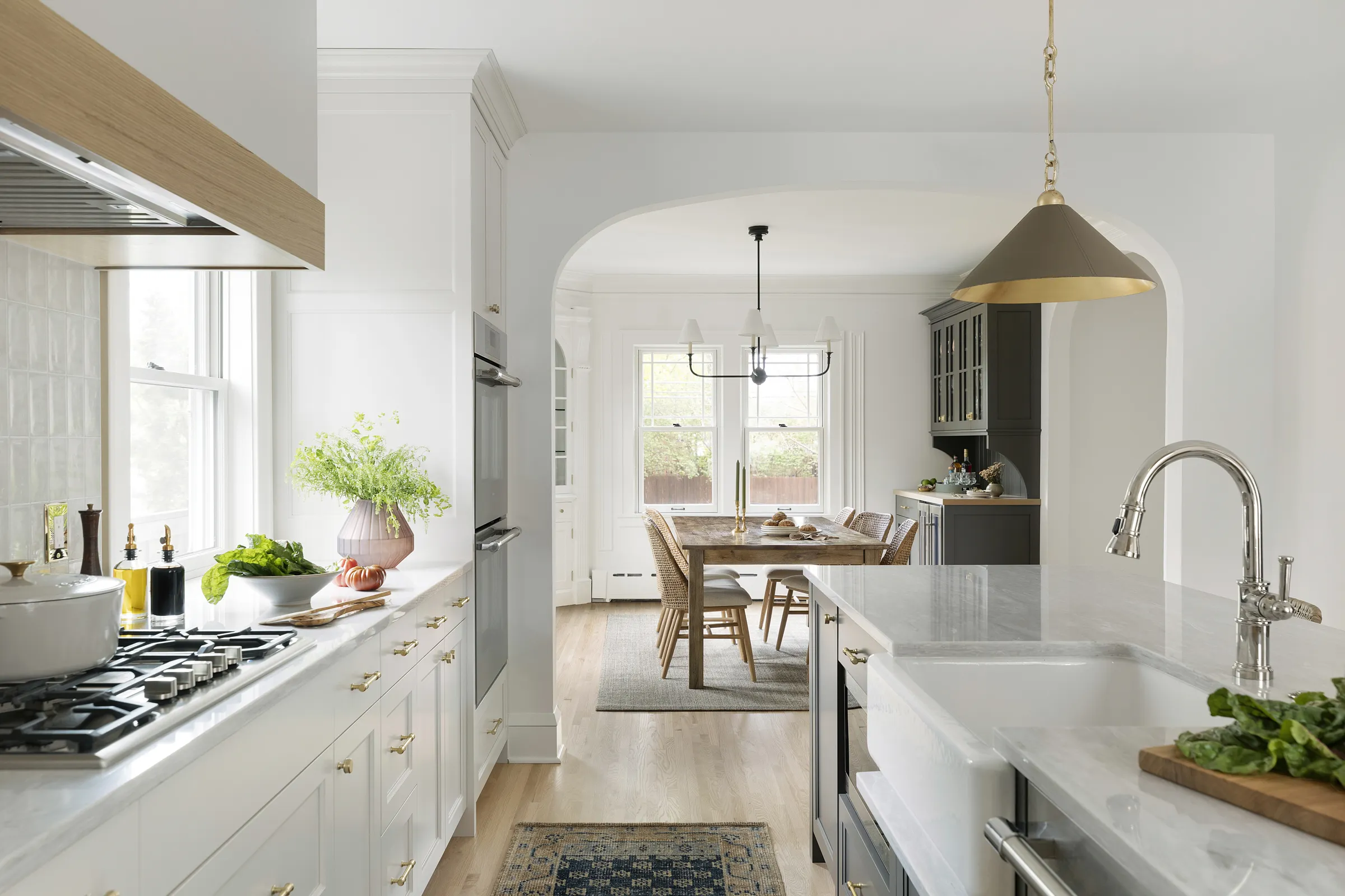 1925 historic colonial, whole house home renovation. Modern amenities, mixed metals, refinished original hardwood flooring and oversized light fixtures.