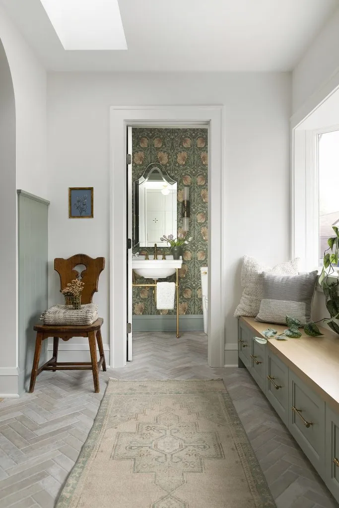 How to Refresh a 1920s Home, While Mixing Modern and Traditional Design Styles. William Morris Pimpernel wallpaper, soft green blue wall paneling, faux brick tiles.