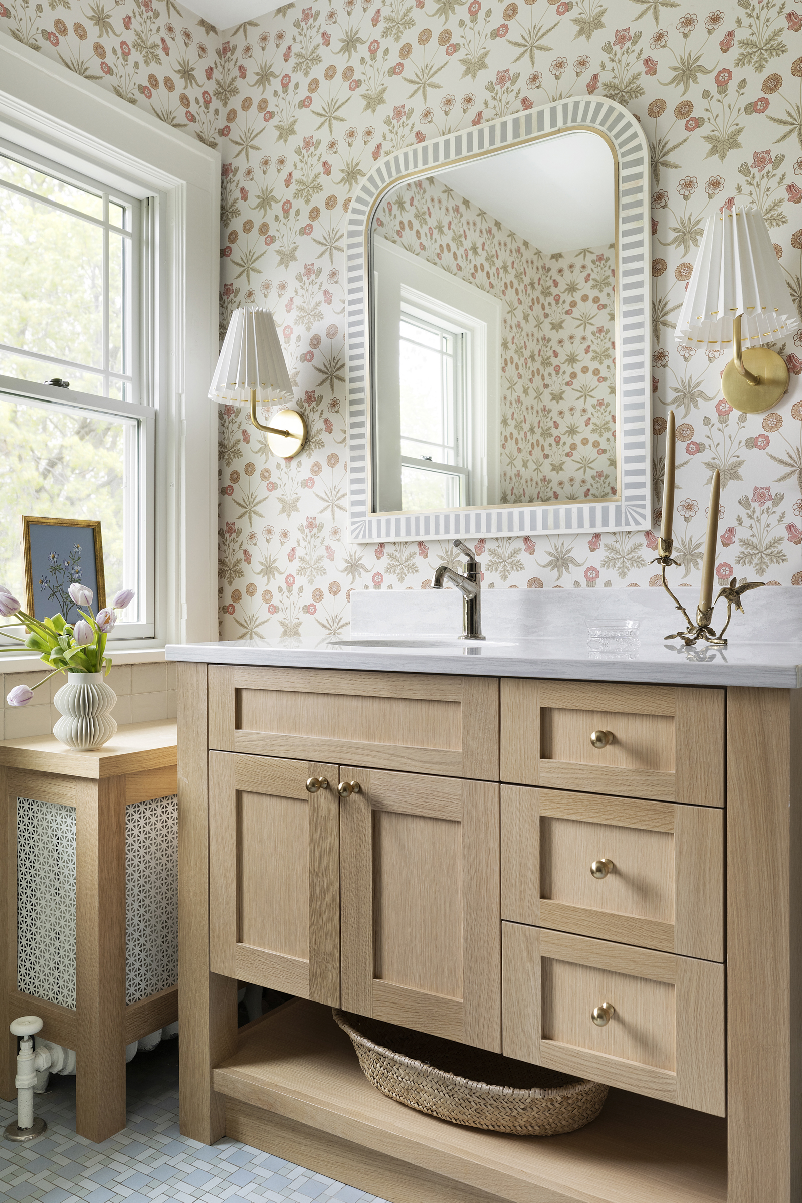 Twin Cities bathroom renovation with white oak vanity and floral wallpaper.