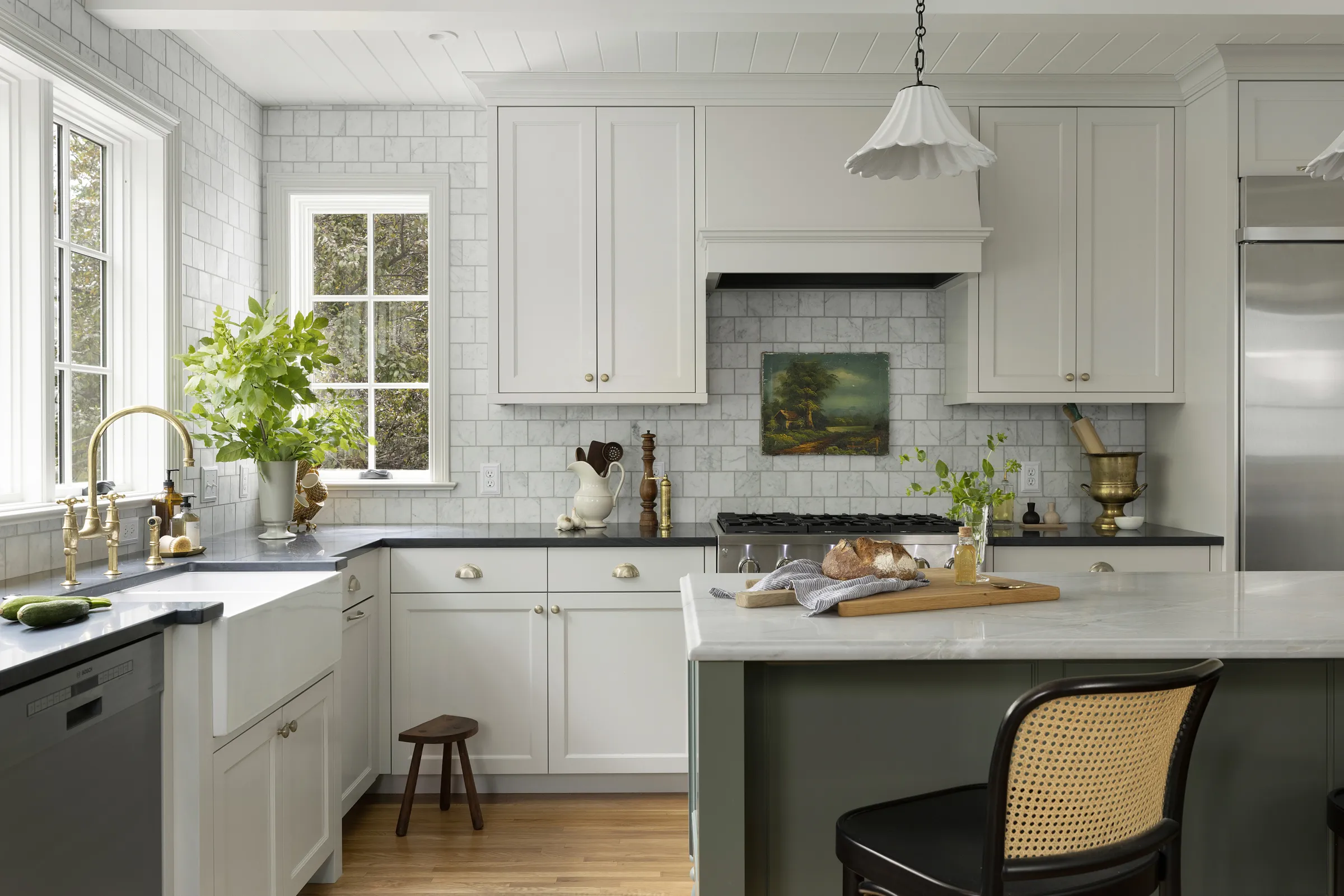 1934 home addition, all new kitchen with two tone cabinetry, wall ovens and cooktop. Quartzite countertops and marble backsplash.